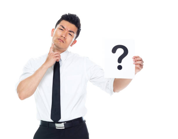 istock Handsome Asian Businessman - is holding a question mark sign 1151888009