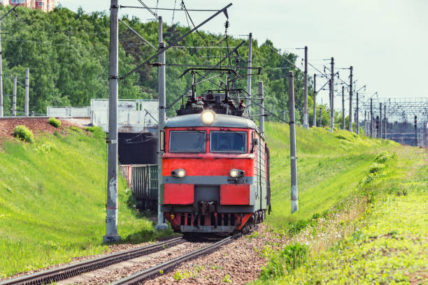 istock Long freight train approaches to the station. 1151888103