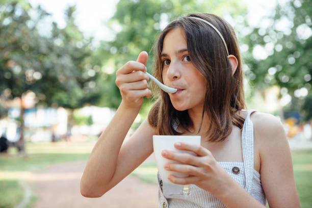 istock Beautiful child eating Ice Cream 1151892866