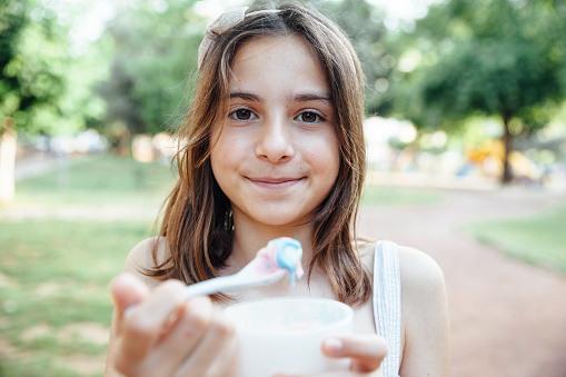 Portrait of little girl holding Ice Cream