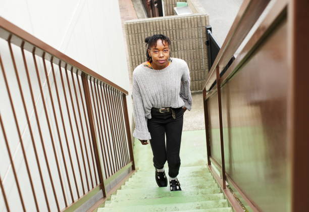 istock Woman  going up the steps 1151903168