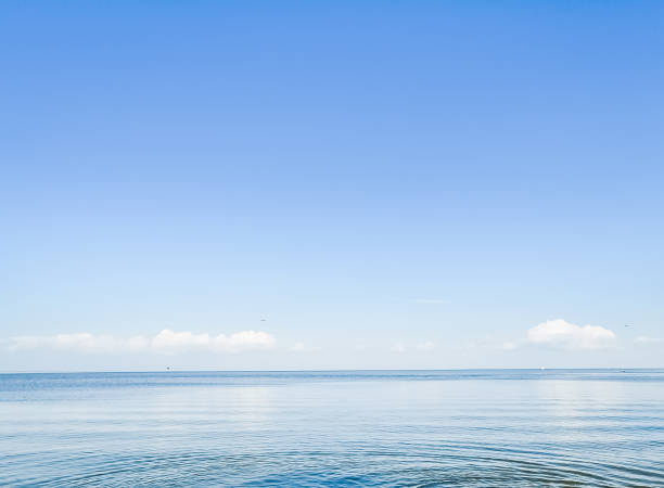 istock Beautiful sunset over sea with reflection in water. 1151914272