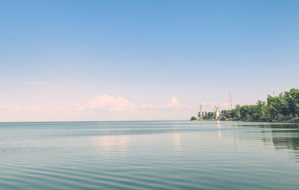 istock Beautiful sunset over sea with reflection in water. 1151914274