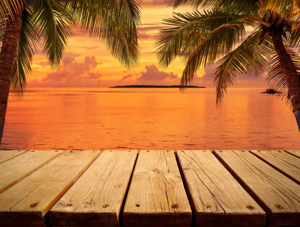 Photo of Wooden platform on the sunset beach