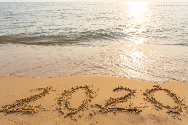 istock Happy New Year 2020 on peaceful beach 1151915158