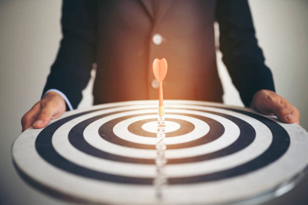 istock Businessman holding dartboard,business concept 1151917187
