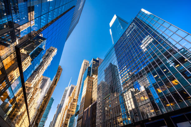 Futuristic skyscrapers in New York City Futuristic skyscrapers in Midtown Manhattan on a sunny day. skyscraper office building built structure new york city stock pictures, royalty-free photos & images