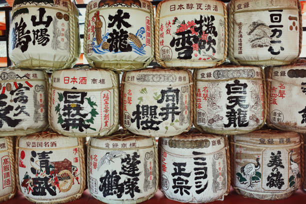 Sake barrels featuring beautiful Japanese script and illustration at the Itsukushima Shrine in Miyajima, Japan