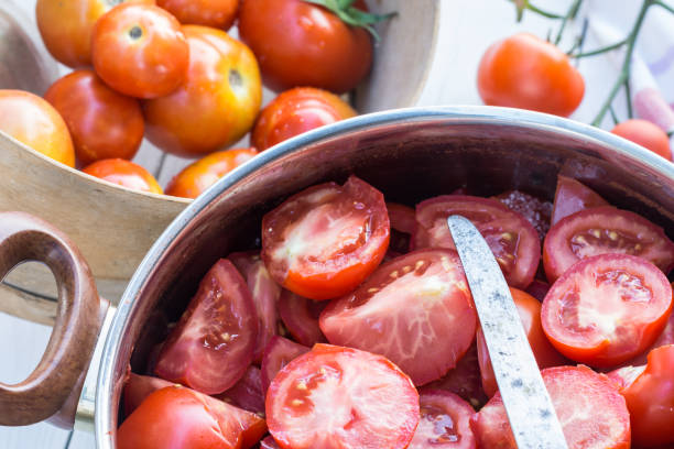 istock Sliced tomatoes in the pot, tomatoes are prepared for preserves 1151921674