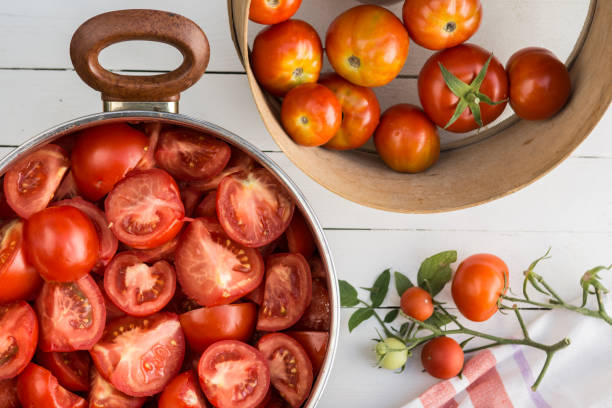 istock Sliced tomatoes in the pot, tomatoes are prepared for preserves 1151921682