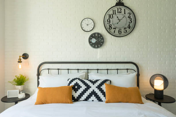 istock Stylish bedroom and clock on wall. Interior concept 1151922522