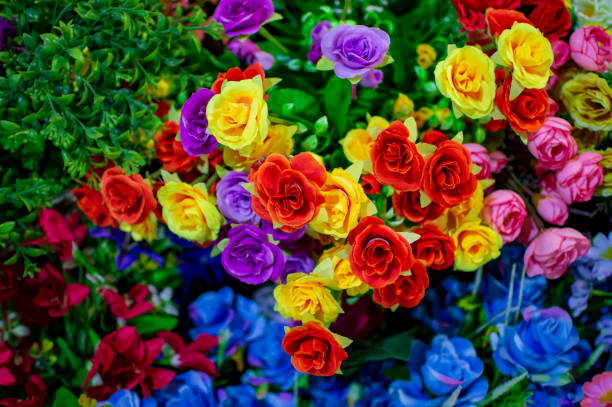 istock Plastic flowers of exotic colors and material 1151922945