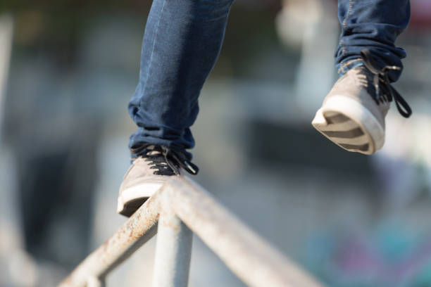 istock parkour jumping on steel pipe with balance 1151923776