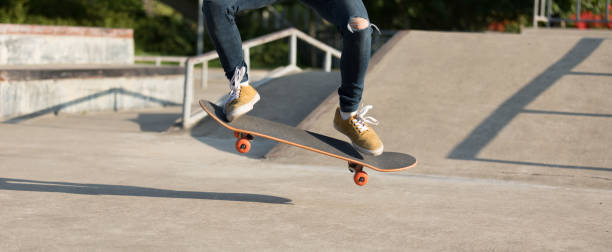 istock skateboarder skateboarding on skate park 1151923962