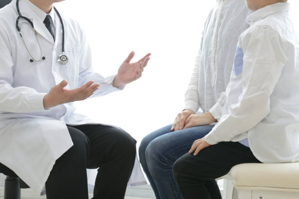 istock Pediatric doctor talking with parent 1151924126