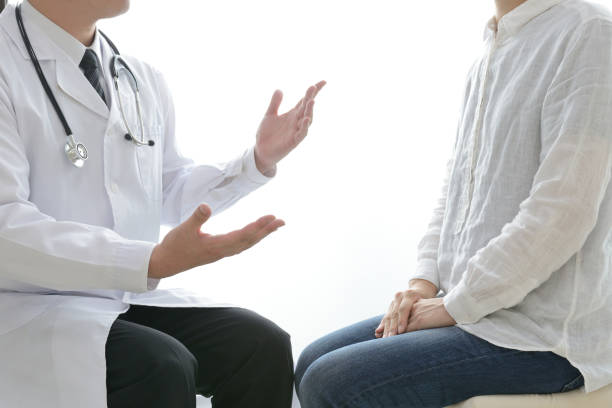 istock Doctor talking with client in consulting room 1151924152