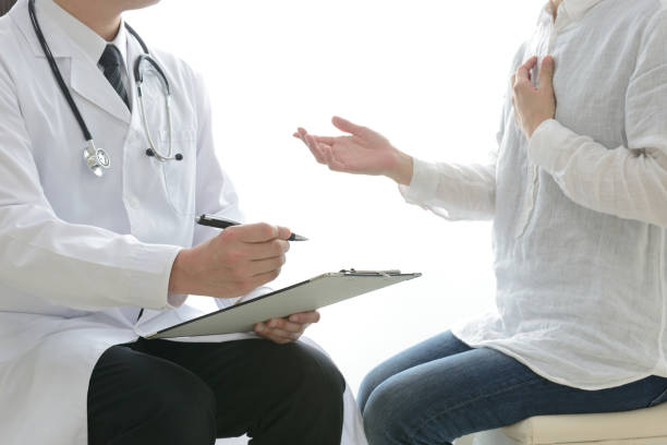 istock Doctor talking with client in consulting room 1151924158