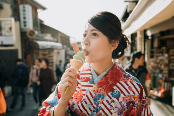 istock happy woman eating matcha ice cream 1151925740