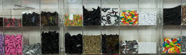 Photo of candys and sweets different colors in supermarket