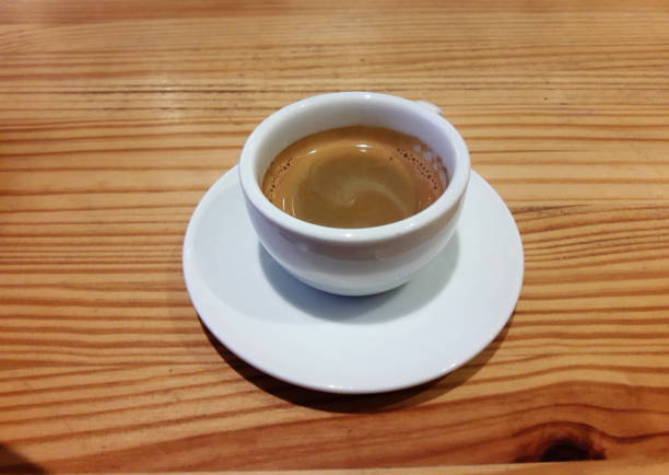 istock Espresso Coffee  in white cup on wooden table 1151929198