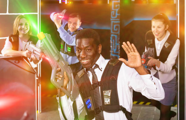 istock Jolly  Afro man and colleagues in laser tag room 1151932905
