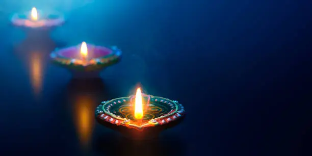 Happy Diwali - Diya oil lamps lit during celebration