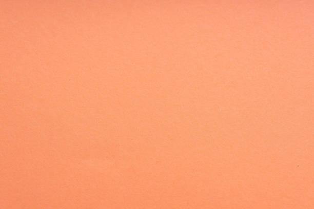 istock Paper background coral color. Rough paper texture. Closeup. Macro. 1151936532
