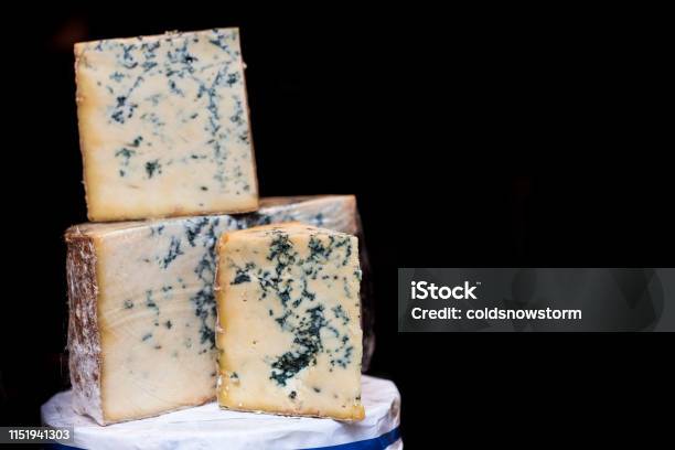 Fresh British Stilton Cheese For Sale At Food Market Stock Photo - Download Image Now