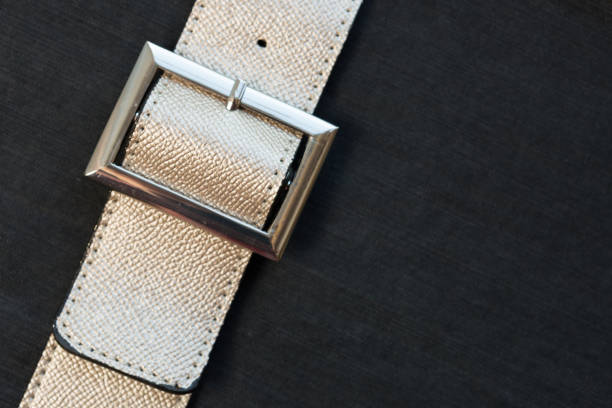 istock Gold-colored leather belt, nahupshot 1151941702