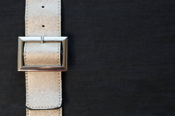 Strapped? Leather belts in gold, close-up