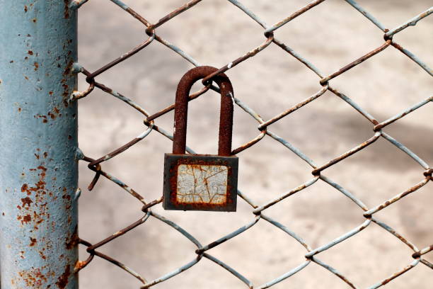 istock old key lock on the metal fence 1151944309
