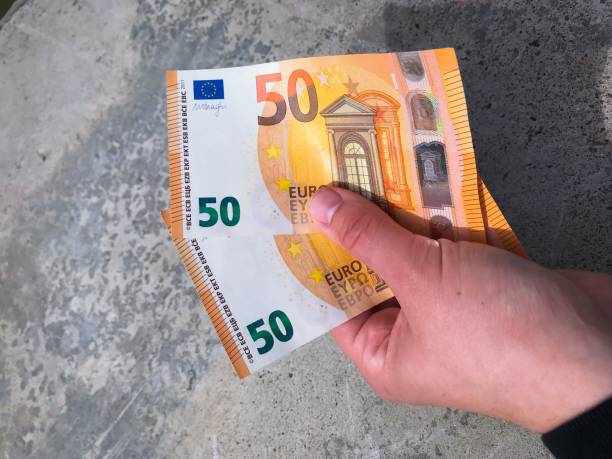 istock 50 euro bills. Stone backround. 1151945517