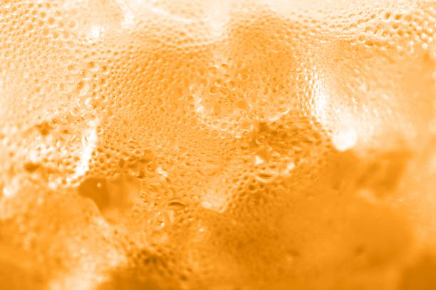 istock water drop soda ice baking background fresh cool ice orange texture, selective focus 1151945710