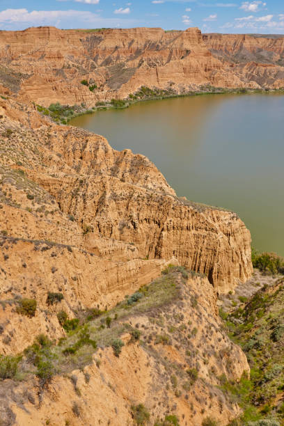 istock Red clay erosion gully and river. Eroded landscape. Spain 1151945805