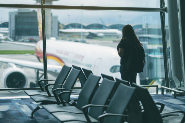 istock A woman with backpack at the airport 1151945908
