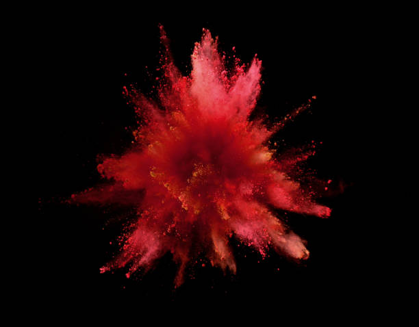 istock Explosion of colored powder isolated on black 1151946185