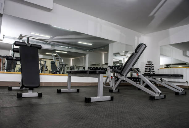 istock Modern and empty gym interior with equipment 1151946254