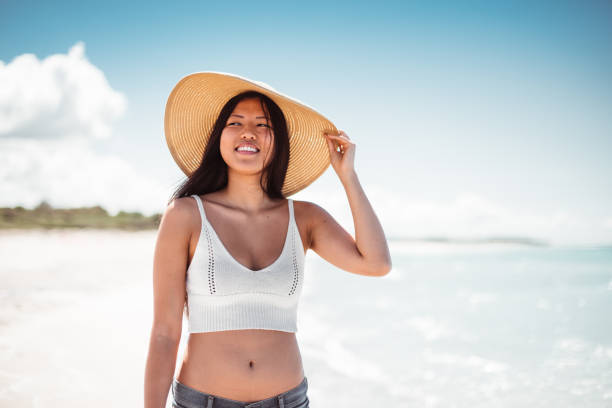 istock freedom woman posing at summer on the beach 1151947334