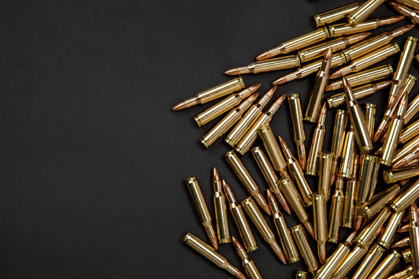 istock Rifle cartridges on a black background 1151958510