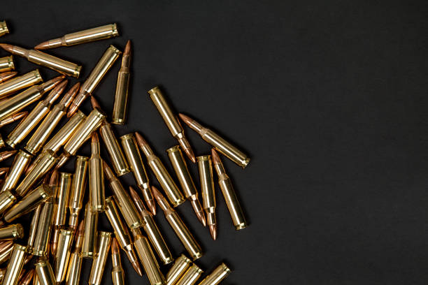 istock Rifle cartridges on a black background 1151958596