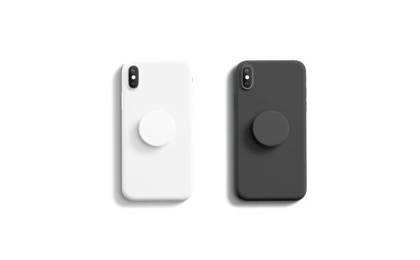 Blank black and white pop sockets attached on mobile phone Blank black and white pop sockets attached on mobile phone mockups, isolated, top view, 3d rendering. Empty rubber popsocket holder on smartphone mock up. Clear round handle stick on cellphone. pop musician stock pictures, royalty-free photos & images