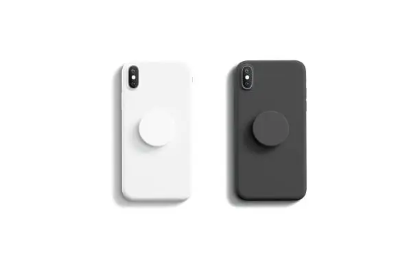 Photo of Blank black and white pop sockets attached on mobile phone
