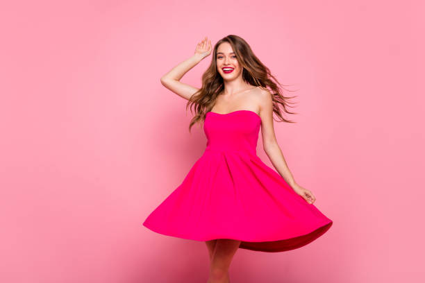 close up photo beautiful she her dancing prom queen lady round wind fly blow air skirt plump rose lips graduation party wear cute shiny colorful dress isolated pink bright vivid background. - full hair imagens e fotografias de stock