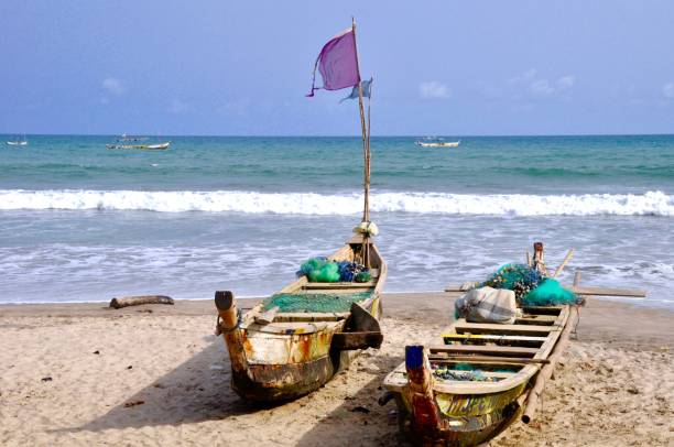 istock Fishing Boats At Beach Against Clear Sky 1151960191