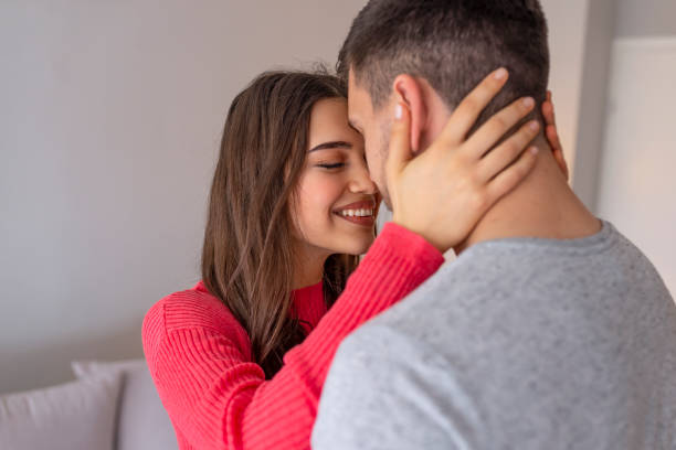 istock Beautiful couple hugging and looking at each other 1151960590