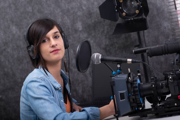 istock brunette young woman working on the radio studio 1151960674
