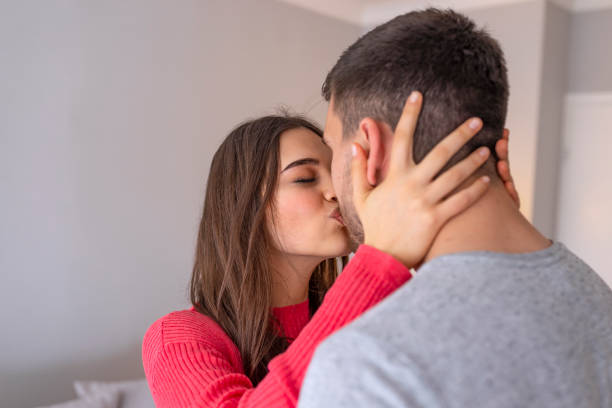 istock Cute couple hugging at home. 1151961386