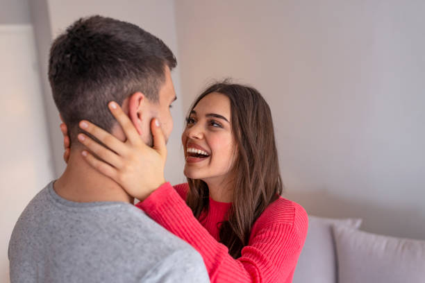 istock Smiling young couple hugging at home. 1151962151