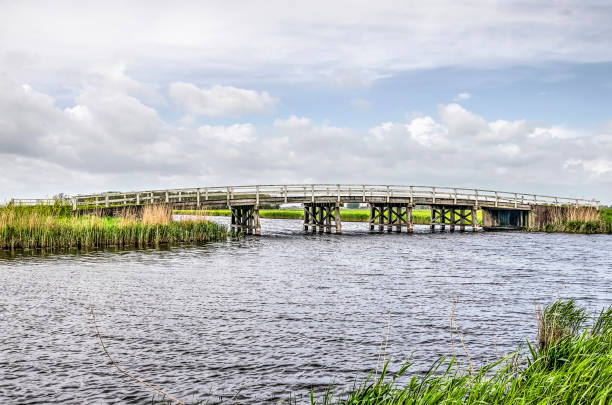istock Polder canals with wooden bridge 1151963046