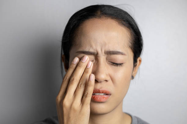 istock Woman suffering from strong eye pain. 1151963778